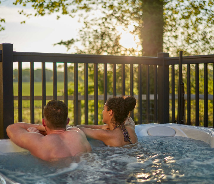 couple sat in a hot tub at Norfolk Woods