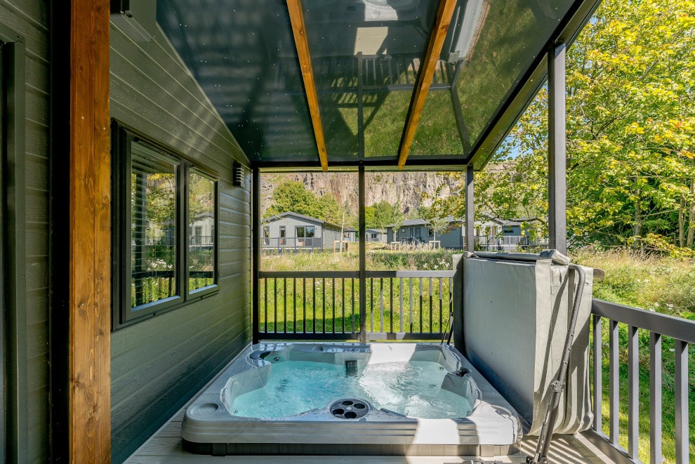 open hot tub surrounded by greenery on hot tub holidays in the peak district
