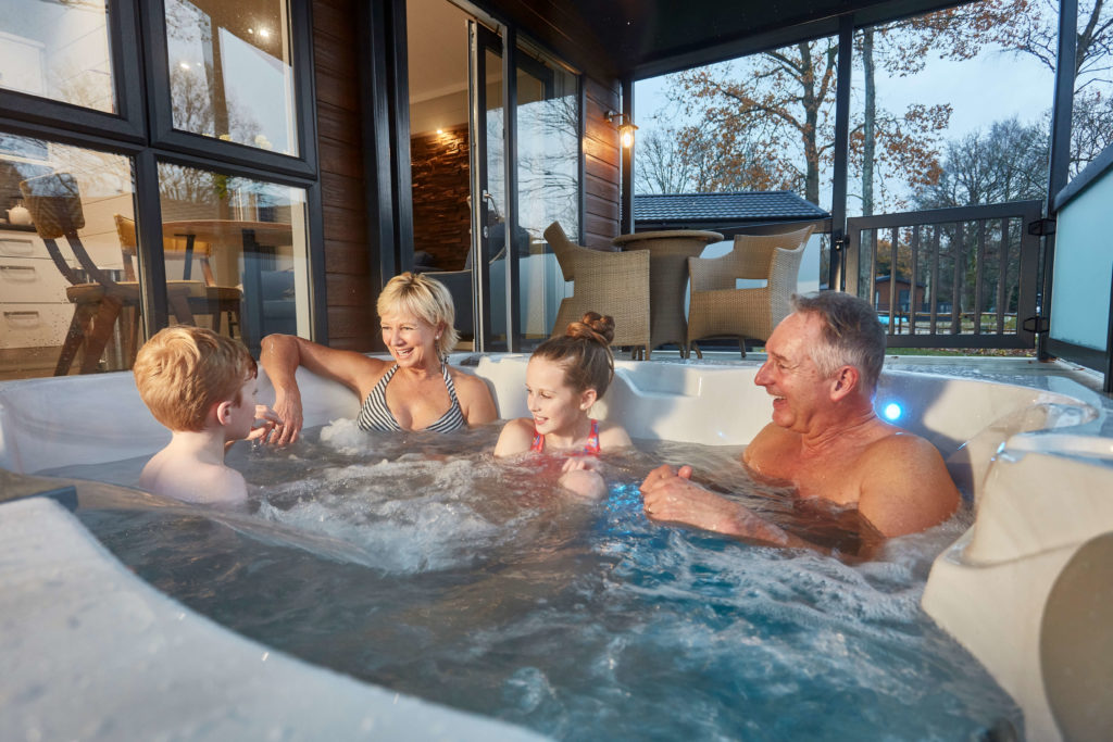 Family sat in a hot tub at Norfolk Woods