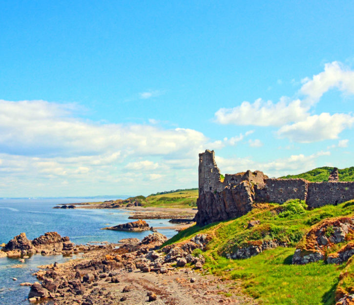 Dunure Castle perched on the side of the land in Scotland